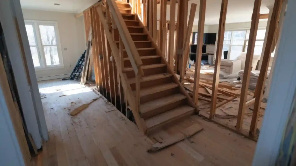 Interior staircase stripped back to its timber framing during a structural rebuild